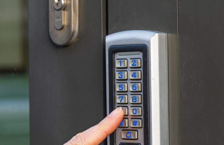 Door access control system with a keypad installed at the entrance of an office in Dubai.