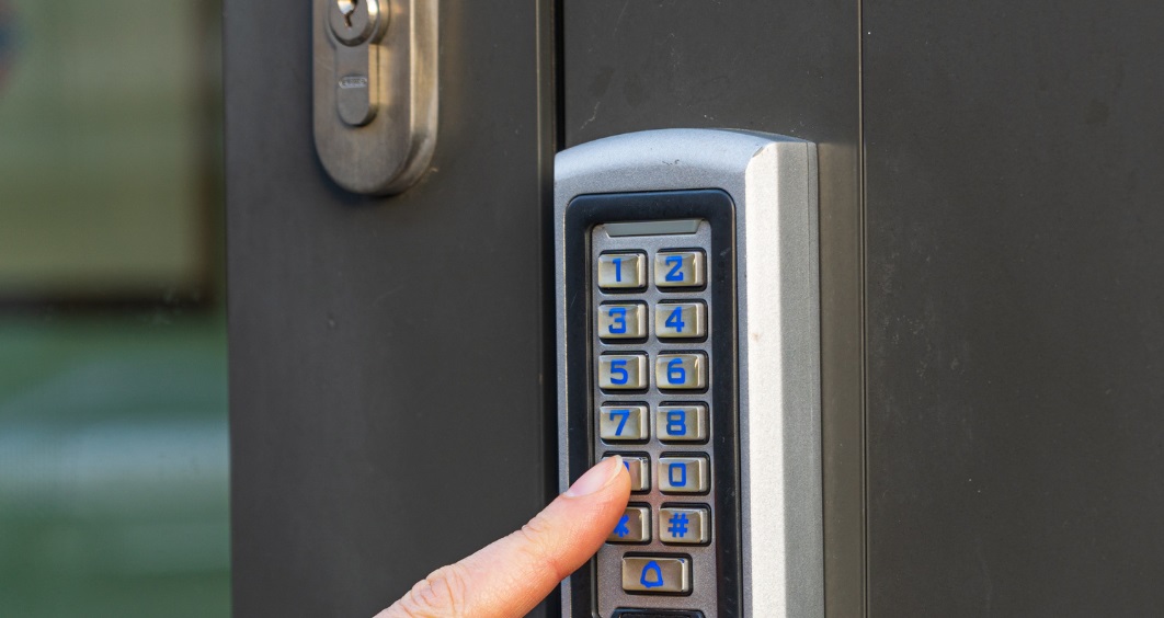 Door access control system with a keypad installed at the entrance of an office in Dubai.