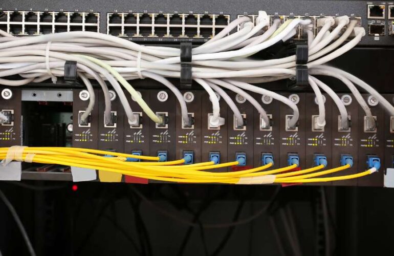 Neatly organized structured cabling in an IT room, ensuring efficient network performance.