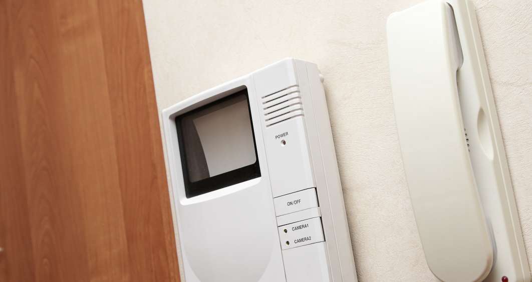 Video intercom system installed in an apartment building, allowing secure communication with visitors.